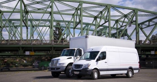 Fleet of white cargo vans ready for dispatch